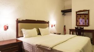 Millenium Popo Beach Hotel客房内的一张或多张床位