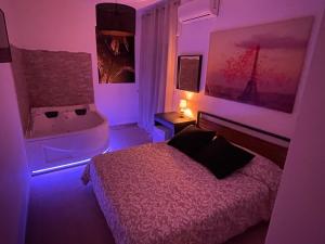 Postel nebo postele na pokoji v ubytování B&B La Perla & Suites