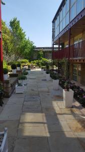 a walkway in front of a building with potted plants at Garrison Hotel in Sheffield