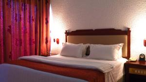 Millenium Popo Beach Hotel客房内的一张或多张床位