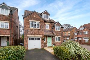 a large brick house with a white garage at Spacious and Modern Townhouse I Pass The Keys in York