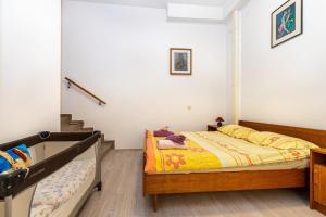 Postel nebo postele na pokoji v ubytování Apartments Biserka in Banjole