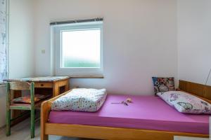 Postel nebo postele na pokoji v ubytování Apartments Biserka in Banjole