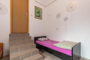 Postel nebo postele na pokoji v ubytování Apartments Biserka in Banjole
