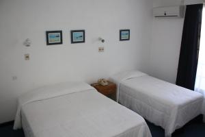 Voodi või voodid majutusasutuse Hotel Escorial toas