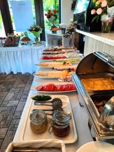 a buffet line with many different types of food at Willa Riwiera in Krynica Morska