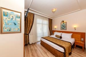 Postel nebo postele na pokoji v ubytování Santa Ottoman Hotel