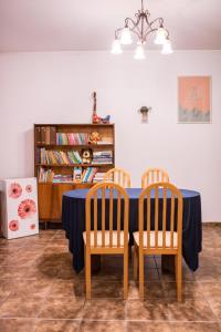 a dining room with a table and two chairs at Pokoje Gościnne u Meresa in Żywiec