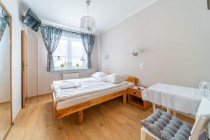 Postel nebo postele na pokoji v ubytování Orchidea
