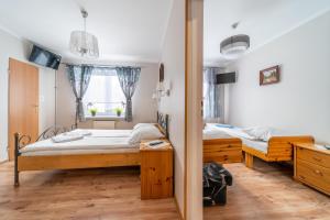 Postel nebo postele na pokoji v ubytování Orchidea