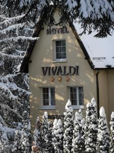 a guest house in the snow at Hotel Vivaldi in Karpacz