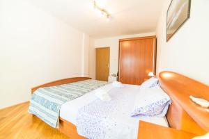 Postel nebo postele na pokoji v ubytování Rooms Glavan 63