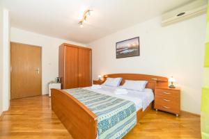 Postel nebo postele na pokoji v ubytování Rooms Glavan 63