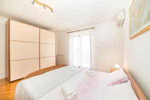Postel nebo postele na pokoji v ubytování Rooms Glavan 63