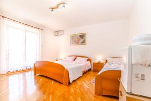Postel nebo postele na pokoji v ubytování Rooms Glavan 63
