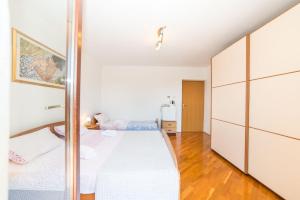 Postel nebo postele na pokoji v ubytování Rooms Glavan 63