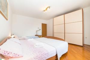 Postel nebo postele na pokoji v ubytování Rooms Glavan 63