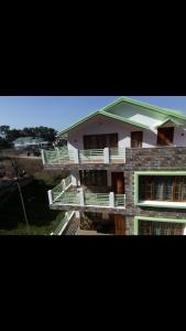 a building with stairs in front of a building at MANNA INSPIRA in Shillong