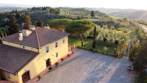 an aerial view of a house with a driveway at Tenuta Barbadoro agriturismo apartment in Montespertoli