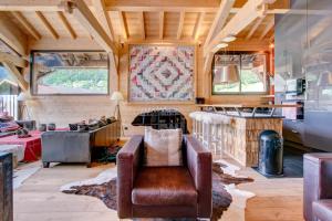 a living room with a couch and a fireplace at Igloo in Morzine