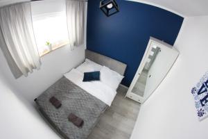Кровать или кровати в номере Domek na Wzgórzu