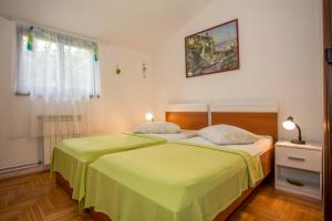 Cama o camas de una habitación en Apartments Rina