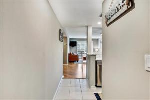 a hallway leading to a kitchen and a living room at Unit 3206 - Ocean & Racquet Resort in Saint Augustine Beach