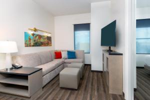 a living room filled with furniture and a window at Hyatt House Tampa Airport/Westshore in Tampa