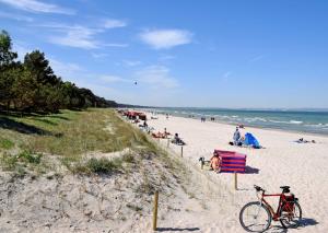 a beach with a bike parked on the sand at Ferienwohnung Karow in Karow