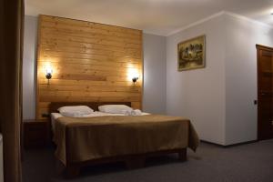 Postel nebo postele na pokoji v ubytování Князів Двір
