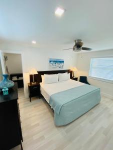 a bedroom with a large bed and two night stands at Blue Sky in Hollywood