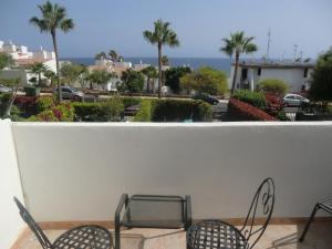 a balcony with chairs and a view of the ocean at Casa Miguel in San Miguel de Abona