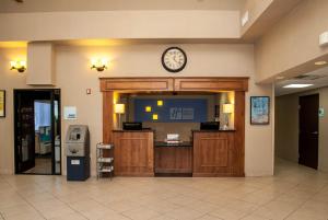 a lobby with a clock on the wall at Holiday Inn Express Tucson-Airport, an IHG Hotel in Tucson