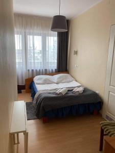 Łóżko lub łóżka w pokoju w obiekcie Victoria Rooms