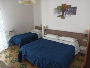Posteľ alebo postele v izbe v ubytovaní Like Home Cisanello