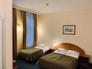 Posteľ alebo postele v izbe v ubytovaní Matejko Hotel