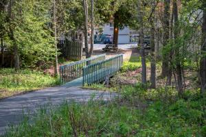 a walking path in a park with a fence at Ridges Inn & Suites in Baileys Harbor