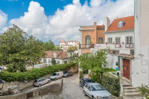 a street in a town with cars parked at Águamel Sintra, Boutique Guest House in Sintra
