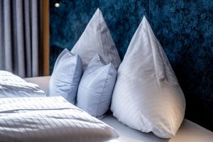 מיטה או מיטות בחדר ב-Hotel FoKus