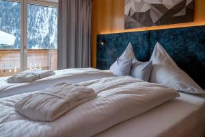 Voodi või voodid majutusasutuse Das Unterrain Lifestyle Hotel toas