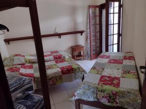 Postel nebo postele na pokoji v ubytování Casa Paraty + 8 fotografií