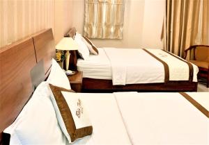 เตียงในห้องที่ Bao Tran Hotel