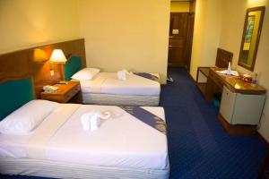 Katil atau katil-katil dalam bilik di Panorama Hotel