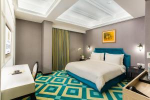 Postel nebo postele na pokoji v ubytování Hotel Des Indes Menteng + 37 fotografií