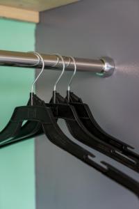 
a pair of black and white ties hanging on a wall at Ratchada Point Hotel in Bangkok
