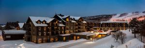 a large building in the snow in the snow at Vestlia Resort in Geilo