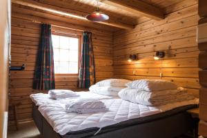 Säng eller sängar i ett rum på Bardøla Fjelltun