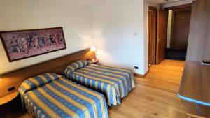 Posteľ alebo postele v izbe v ubytovaní Hotel Luna