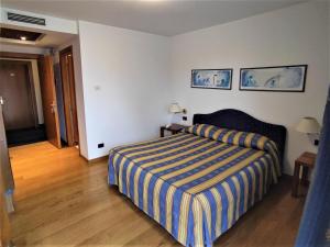 Posteľ alebo postele v izbe v ubytovaní Hotel Luna
