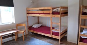 Rúm í herbergi á Marsbäcken Hostel